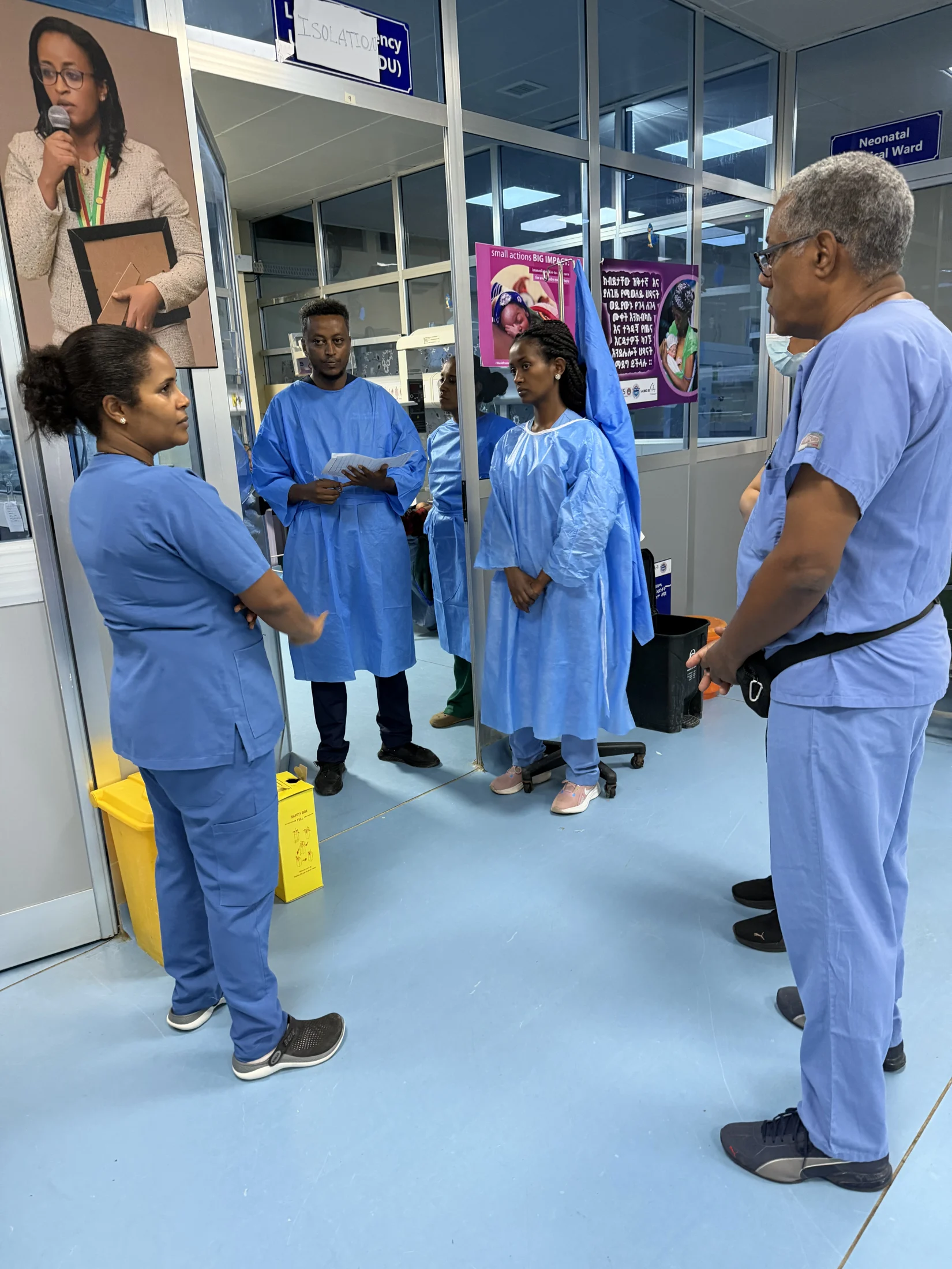 Medical professionals discussing care in the neonatal unit