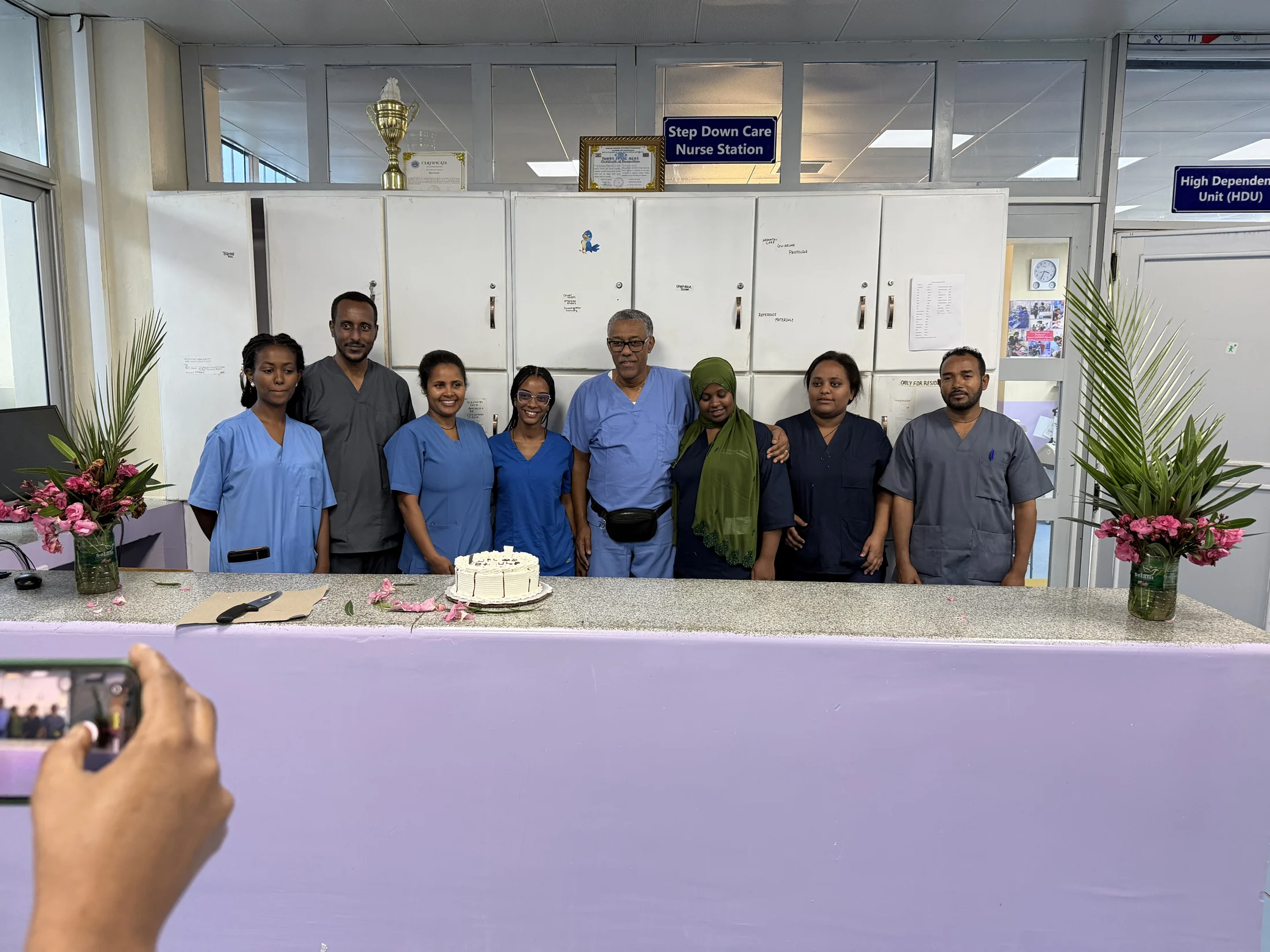 The team gathered at the nurses’ station