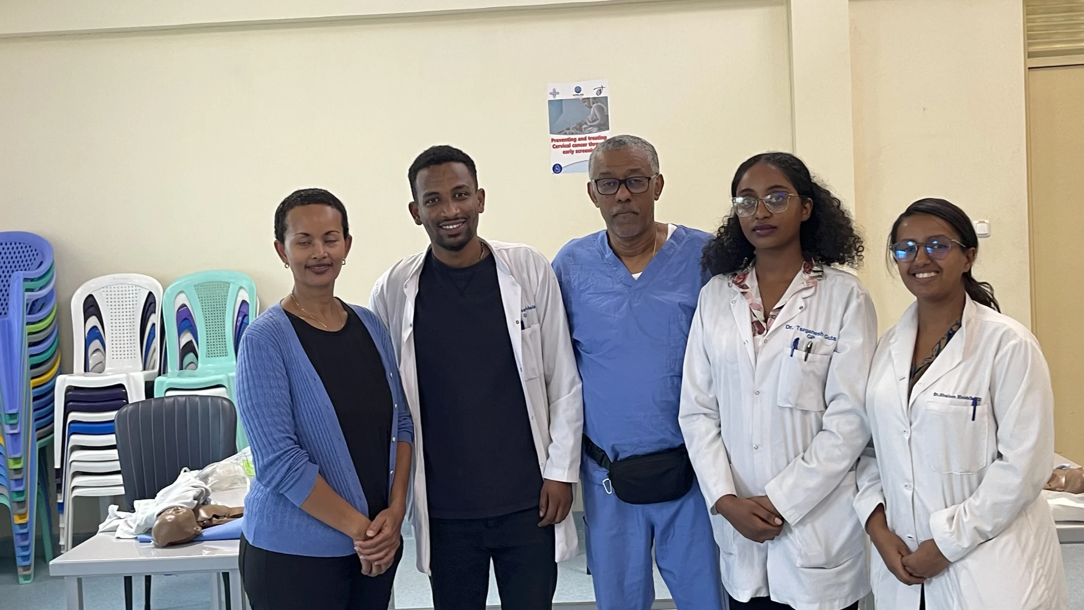 Five team members together after a training session