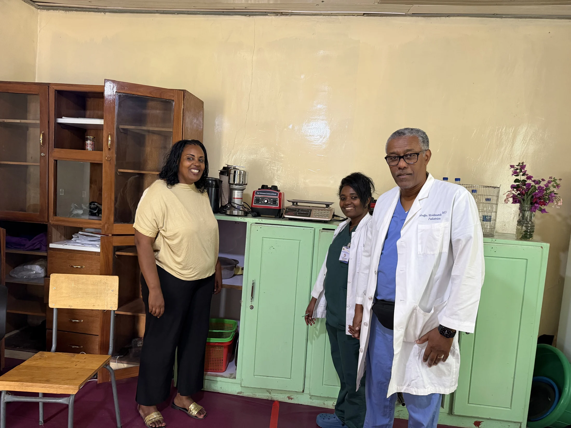 Three team members together in a hospital office