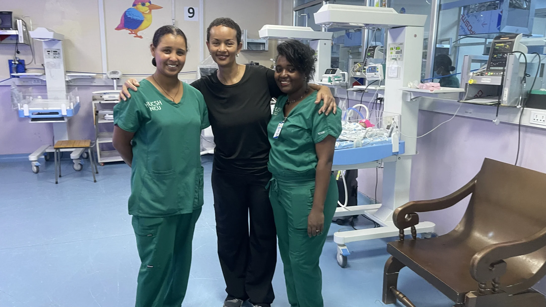 Three medical professionals together in the neonatal unit