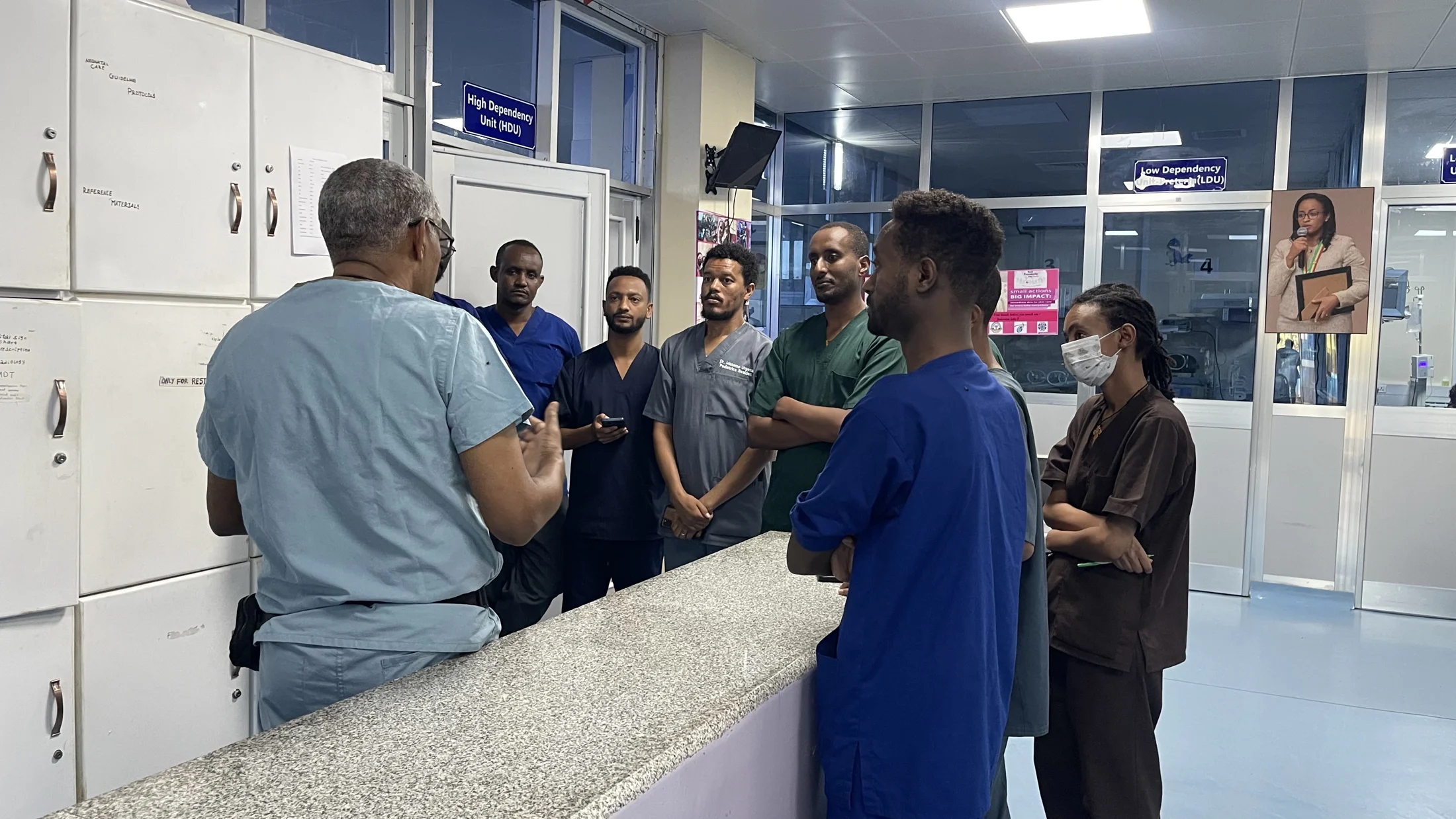 Medical professionals exchanging knowledge at the nurses’ station