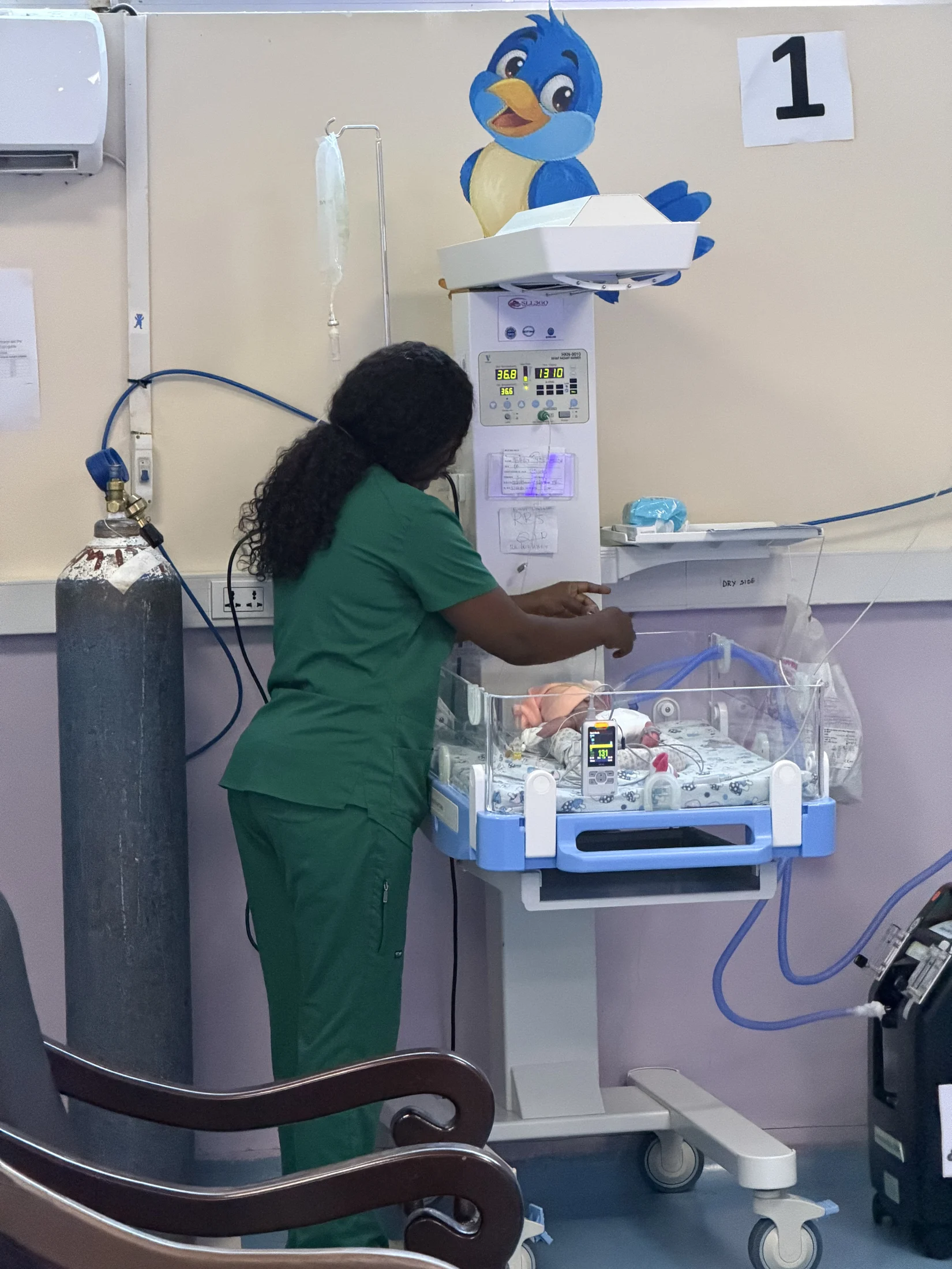 A medical professional tending to a newborn